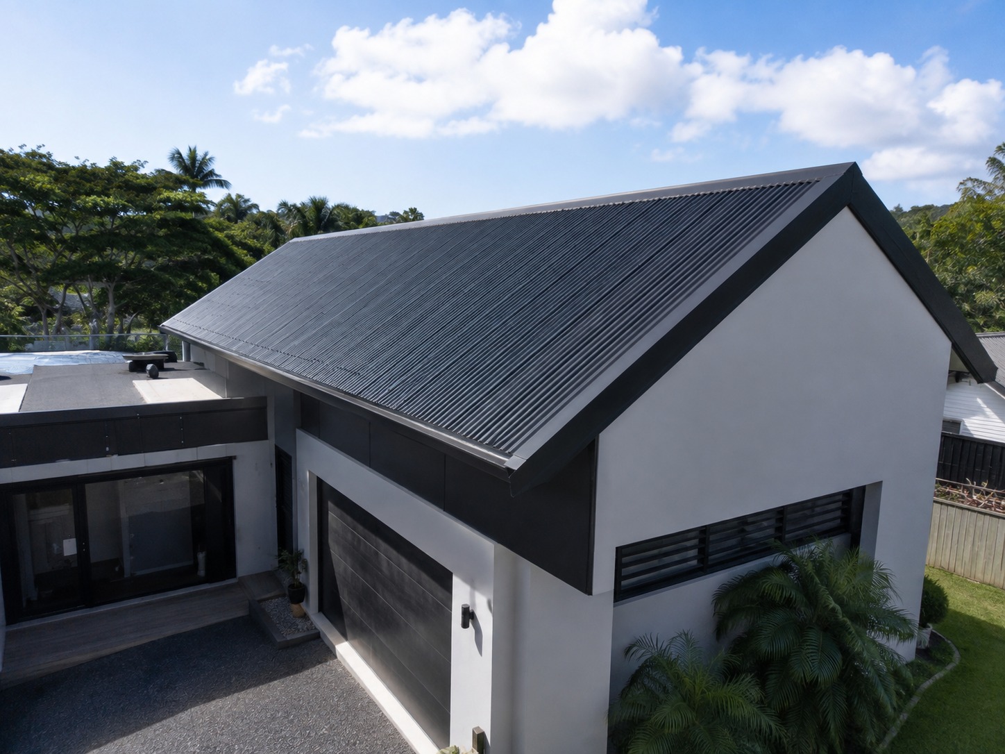 Whangarei roofing experts — long-run Colorsteel roof on a modern home